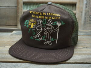 “My Hearts In Farming” But my ASS is in DEBT. Hat