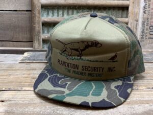 “Plantation Security Inc.” “The Poacher Busters” Rope Camo Trucker Hat
