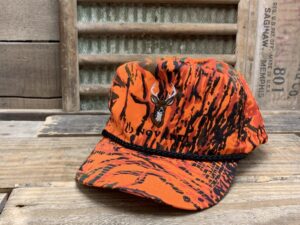 Novartis Buck Orange Camo Rope Hat